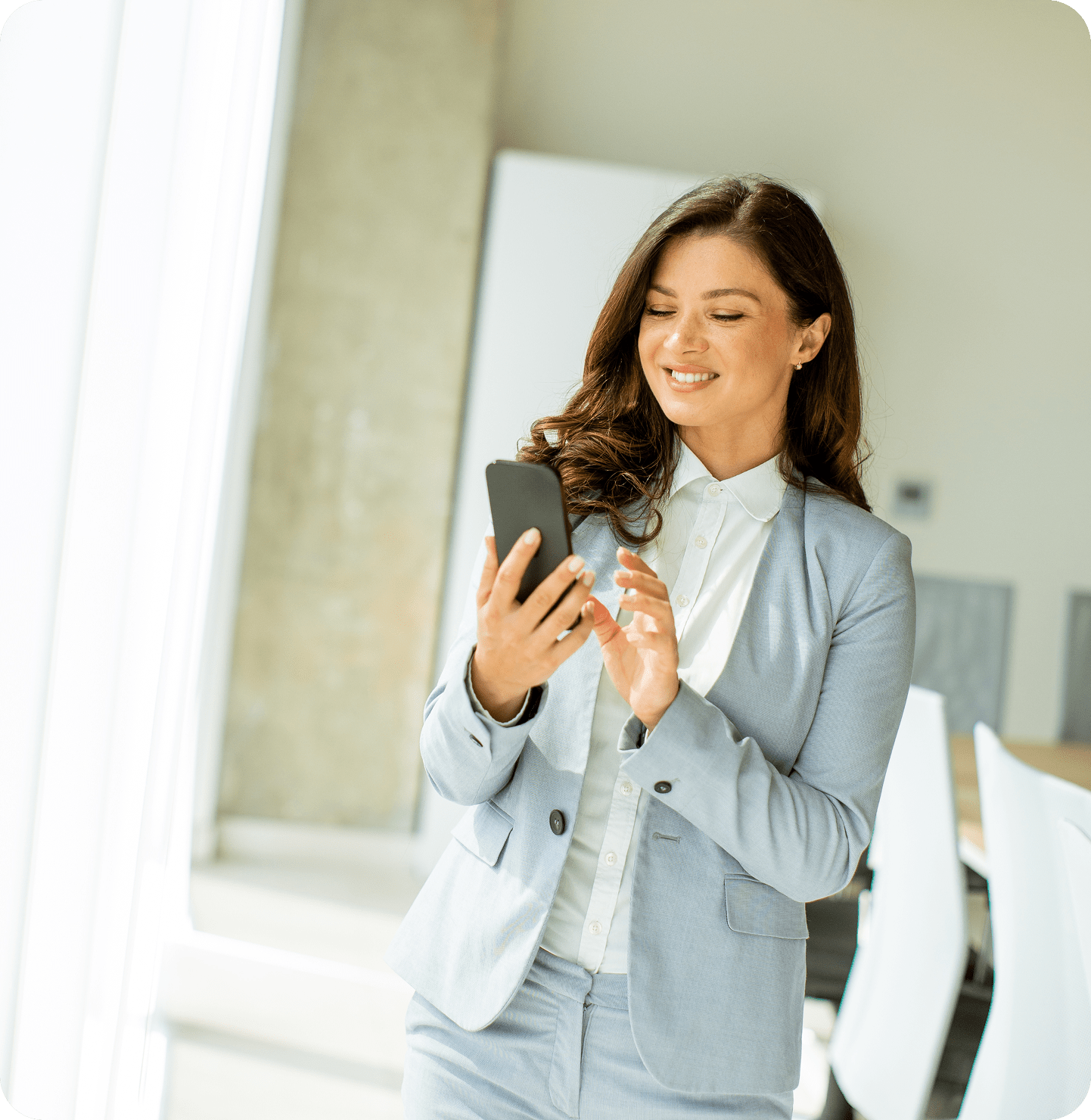 young woman using mobile phone by the office windo 2025 02 21 13 57 05 utc 1 min